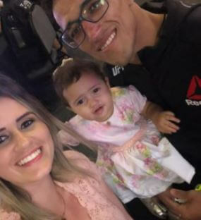 Talita Roberta Pereira with her husband Charles Oliveira and daughter Tayla.